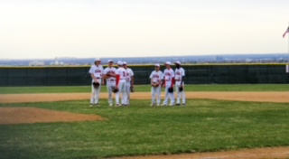 Team meets before final inning.